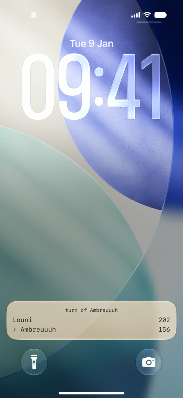 An iPhone Lock Screen showing the Yam's Live Activity with the current turn and both players' scores.